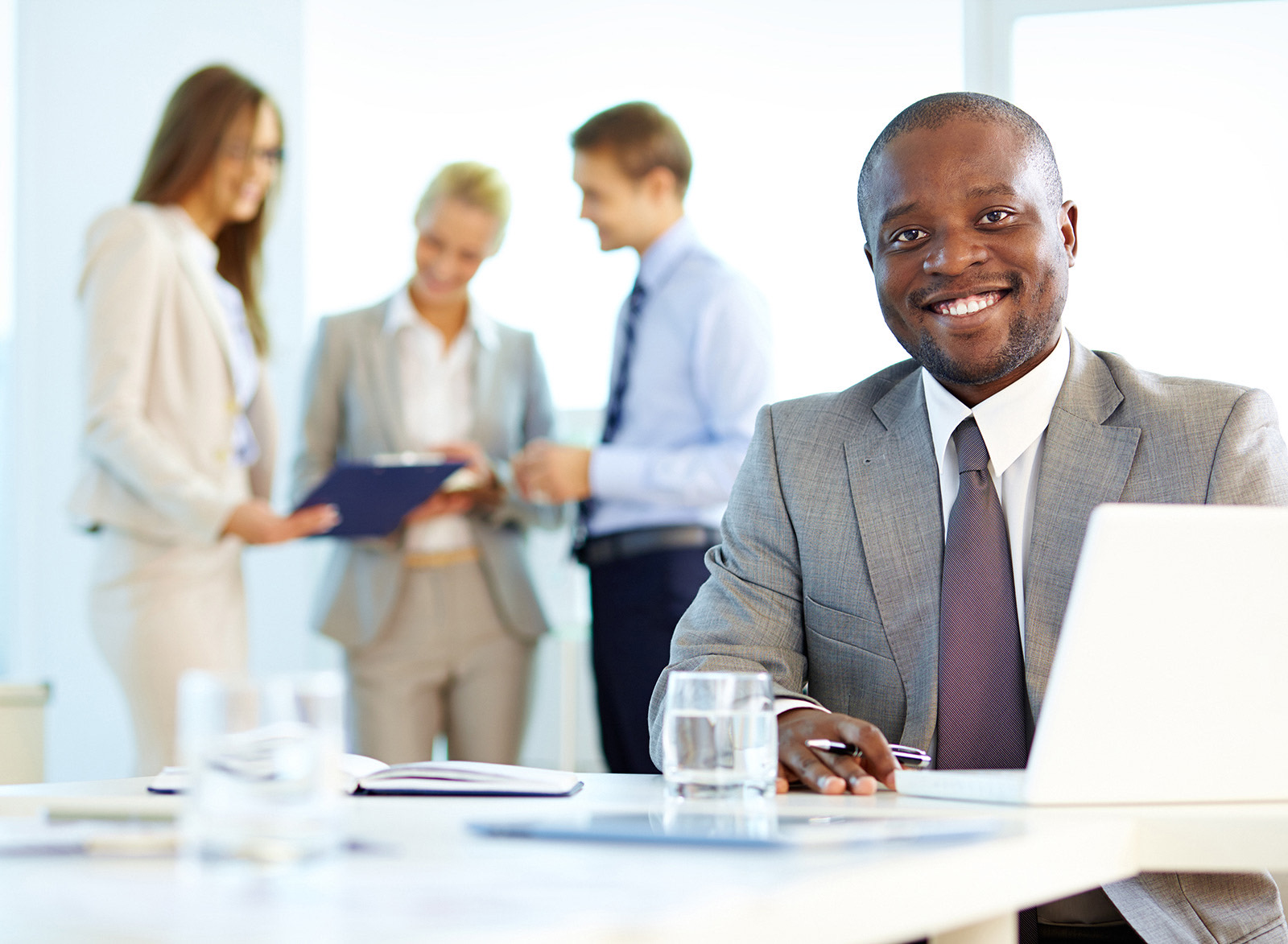 https://global-analytics.co.uk/wp-content/uploads/2023/09/executive-smiling-with-laptop.jpg